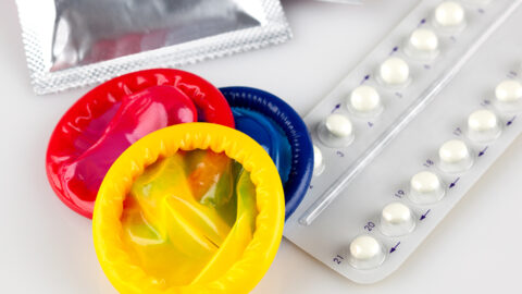 Photo of condoms and oral birth control pills
