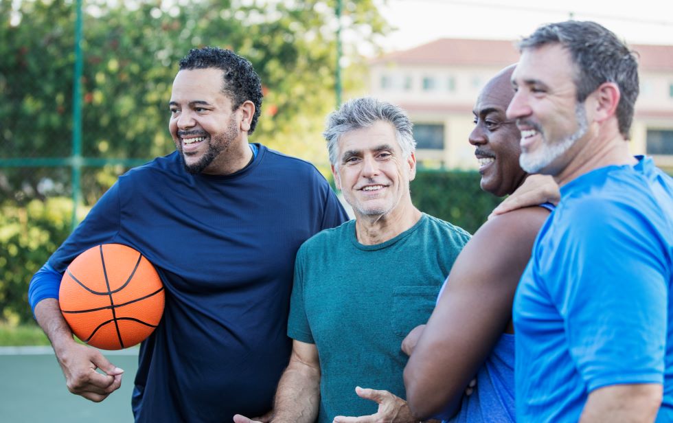 A group of men over 40 with a basketball